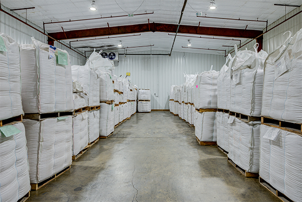 Warehouse space with white mini-bulk bags